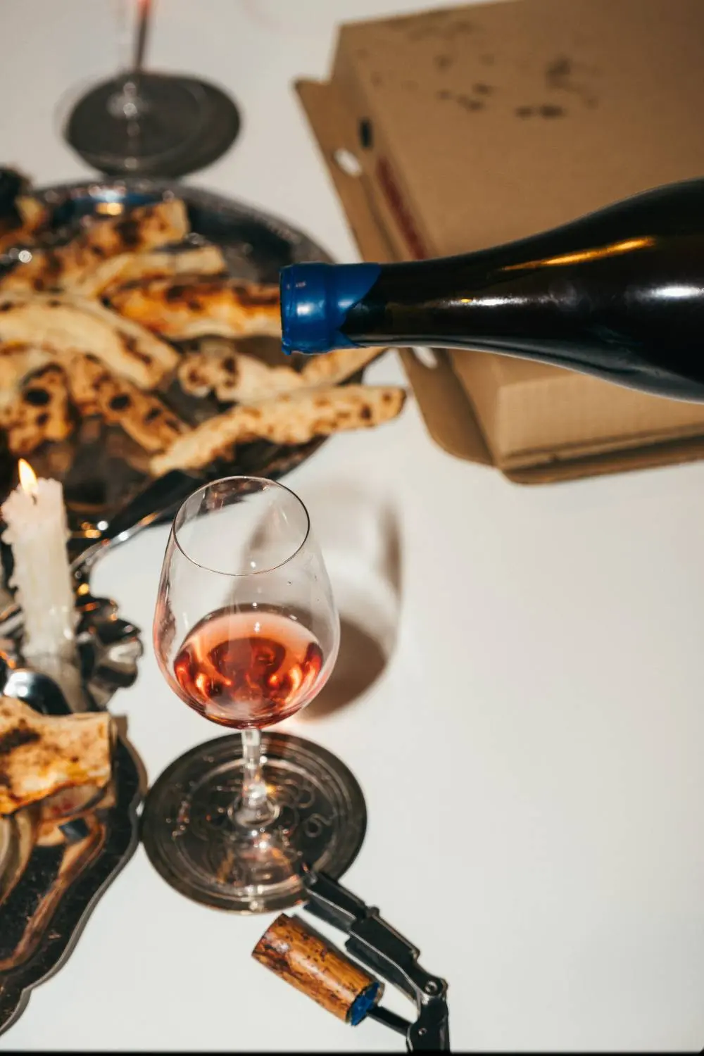 Juicy red natural wine paired with pizza.