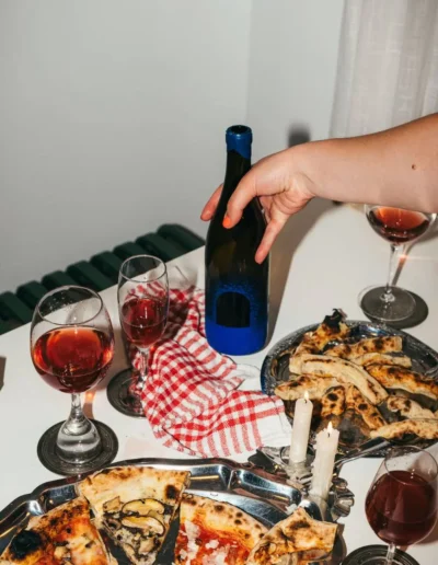 Juicy red natural wine paired with pizza.