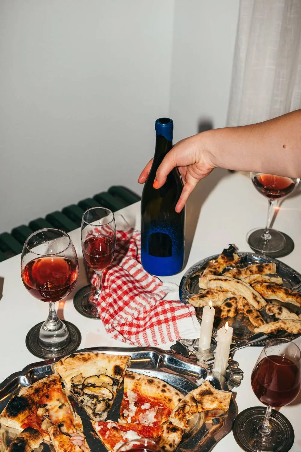 Juicy red natural wine paired with pizza.