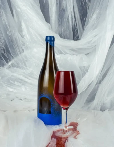 Overflowing glass of natural wine by Suc Suc.