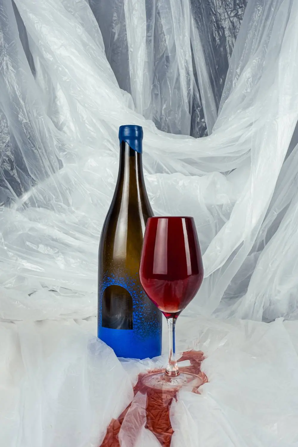 Overflowing glass of natural wine by Suc Suc.